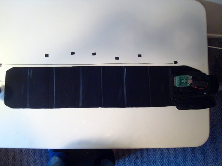 For the cables that connect the Haptic Cape to the tactors, take your 26 AWG wire and measure out two lengths that start at the leftmost mark and travel to the middle of the desired tactor placement with an additional inch added for slack.