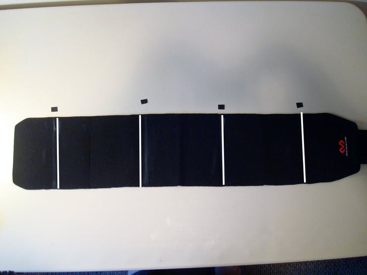 Lay the belt out on a work surface and, using the space between the other marks as a guide, mark the final direction that would have been placed at your back.