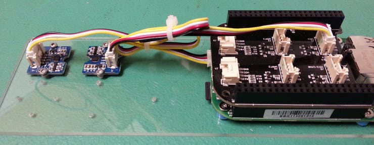 The compass (second from left) connected to the Grove Cape (i2c-1) connector.