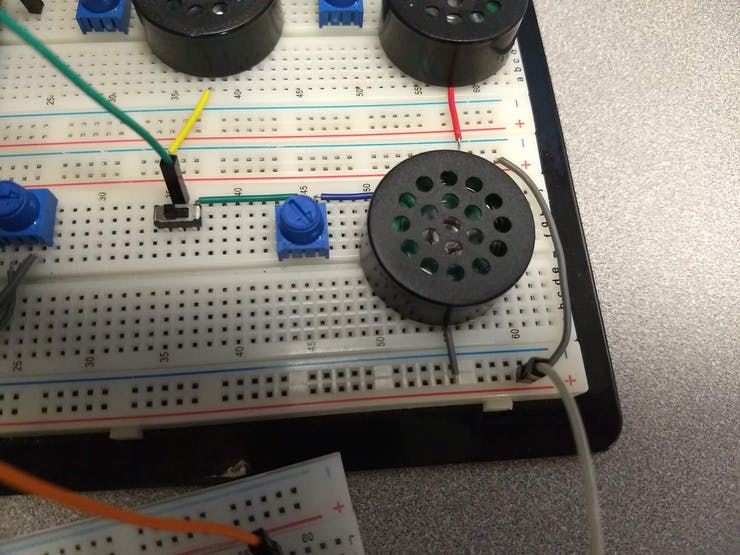 Metronome Assembly. Left to right: Tempo knob, power switch, volume, speaker